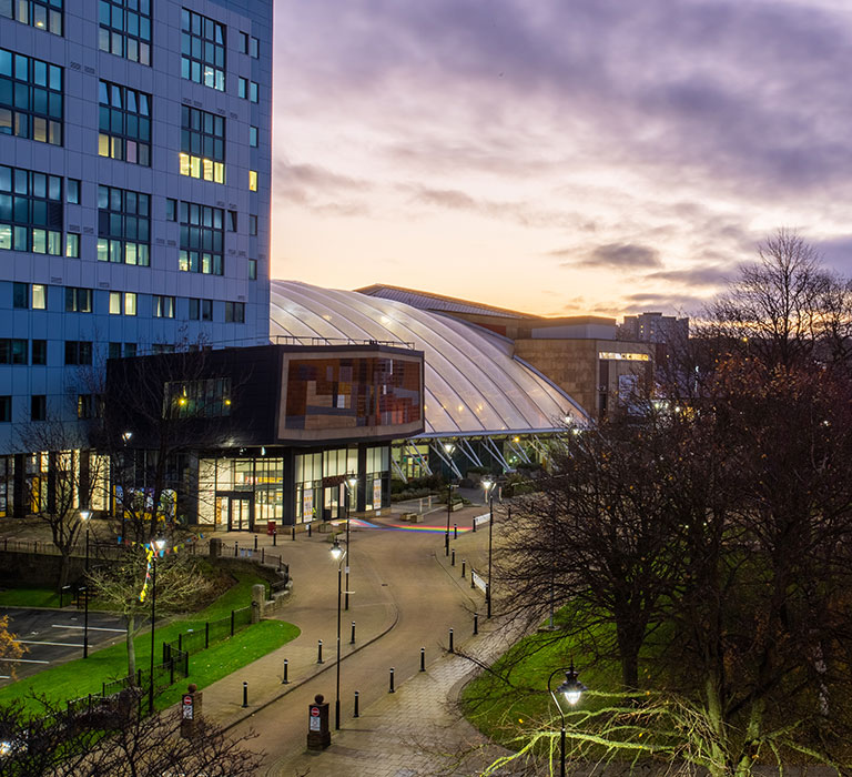 University of Bradford campus lit up at night.