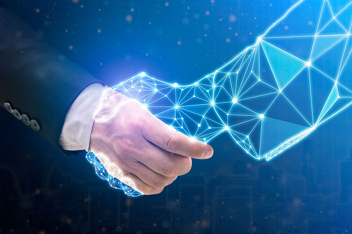 Business human and robot hands shake