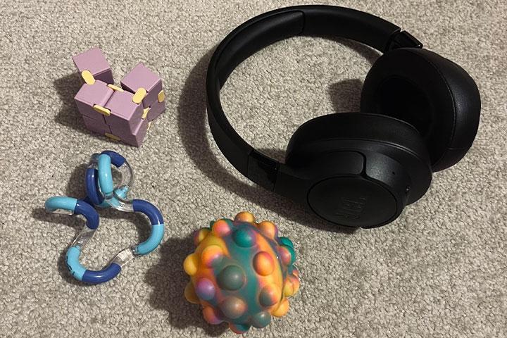 A selection of fidget toys and noise cancelling headphones.