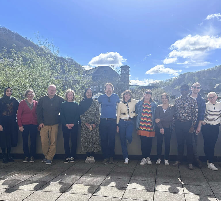 Staff members at the Centre for Applied Dementia Studies posing outdoors while on their writing retreat.