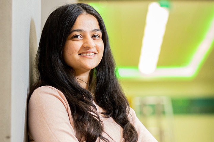 A student smiling at the camera