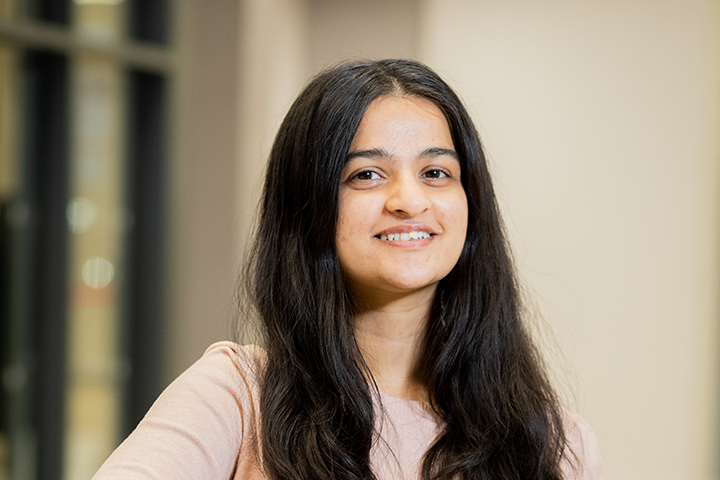 A student smiling at the camera