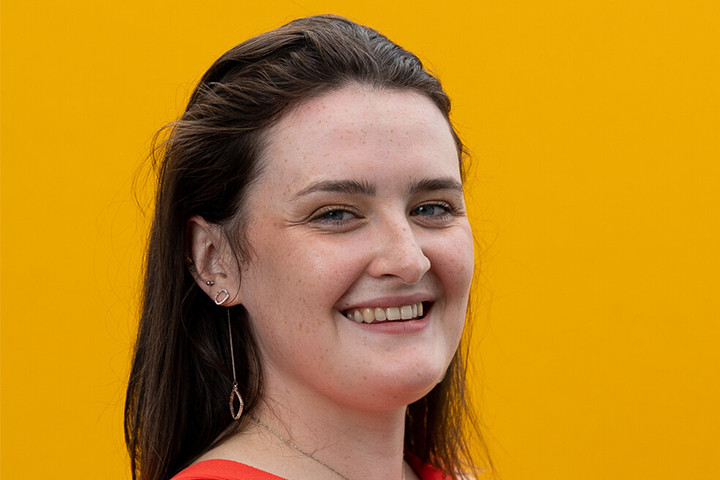 A student smiling at the camera