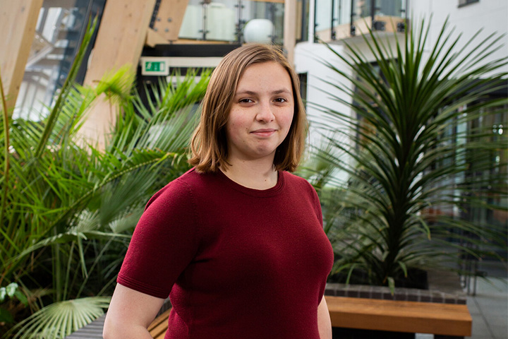 A student smiling at the camera