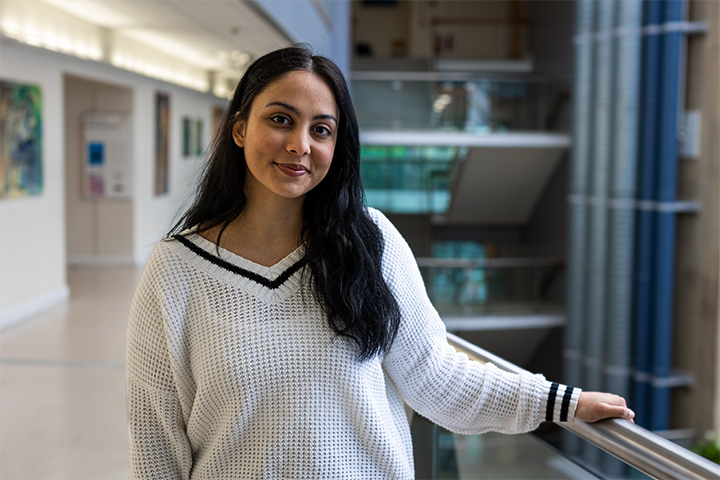 A student smiling at the camera