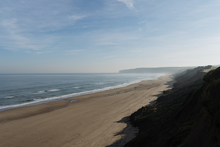 Beach in Filey on a sunny day, taken by Al Elmes on Unsplash