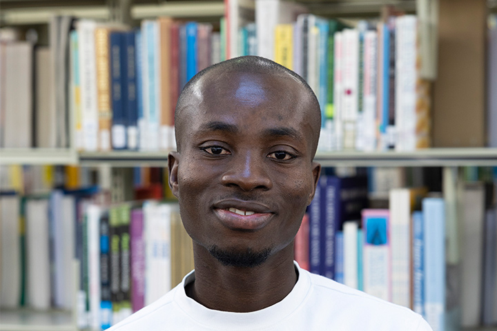 A student smiling at the camera