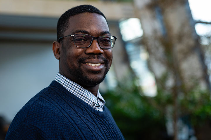 A student smiling at the camera