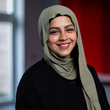 A student smiling at the camera