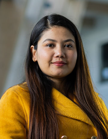 A student smiling at the camera