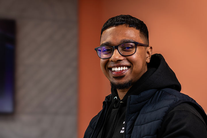 A student smiling at the camera