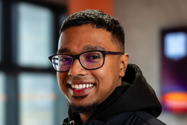 A student smiling at the camera