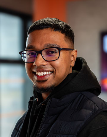 A student smiling at the camera