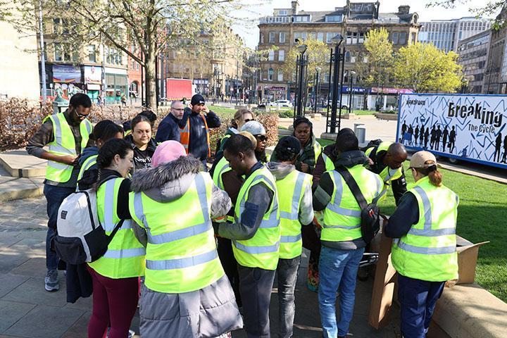 A group of children litter picking in City Park, Bradford