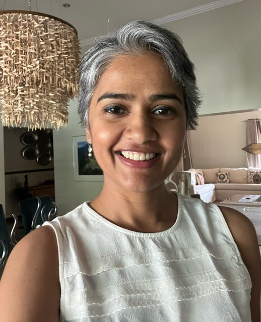 Aravinda Ram, an MBA Distance Learning alumna, posing in her home