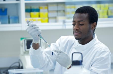 Man in laboratory with test tube equipment