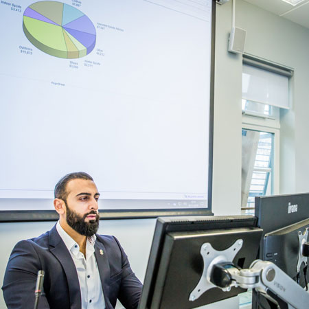 A person sitting on a computer 