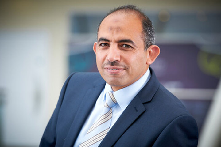 Mostafa Mohammed posing in the Atrium in the Richmond Building.