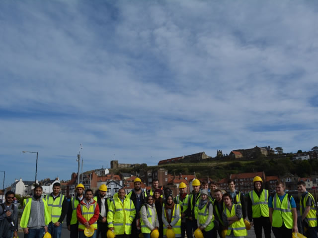 Students wearing high-vis jackets and hard hats in Whitby.