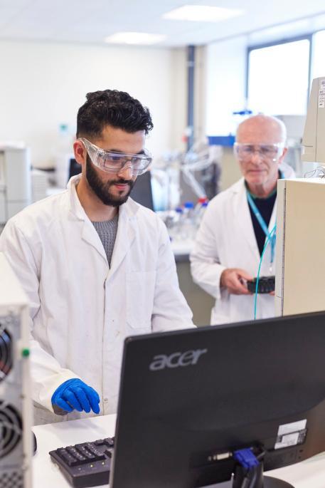 Andrew Healey and Student in lab