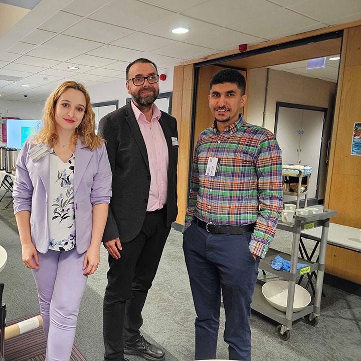 Three Bradford academics attending a conference