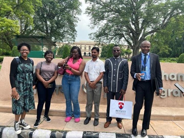 Students Standing infront of tree