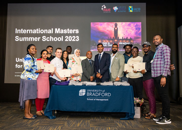 Group photo of students and academics after award presentation