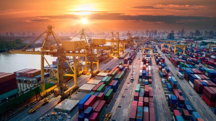 Image of large numbers of shipping containers waiting on dockside