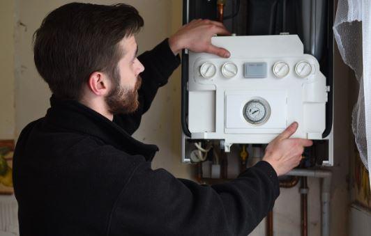 Engineer fixing a boiler