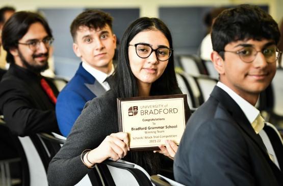 Pupils from Bradford Grammar School with winning 'mooting competition' trophy