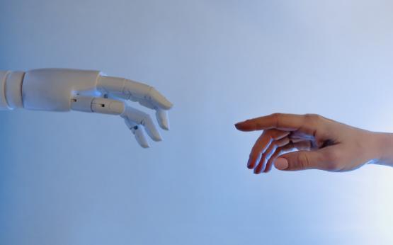 Robot hand reaching for human hand