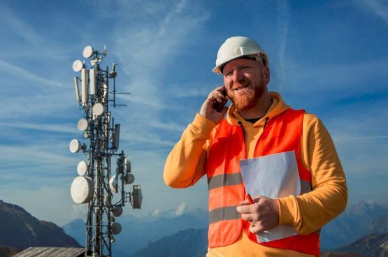 Technician speaking on a mobile phone