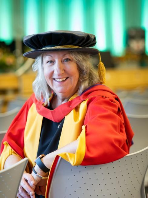 Honorary graduate Rebecca George wearing robes