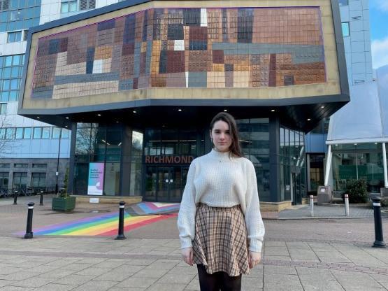 Student stood outside main university building