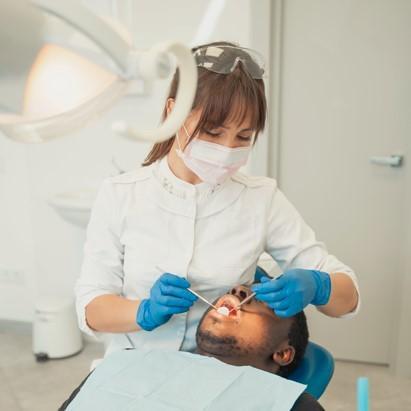 A dentist treating a patient