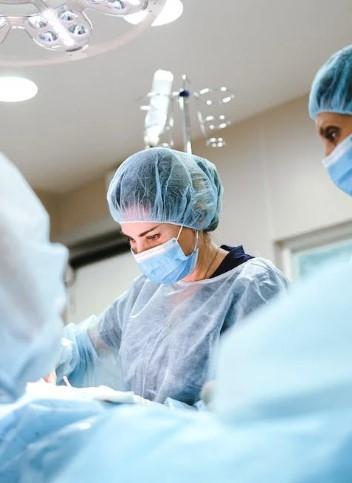 Surgeons working on a patient in an operating theatre