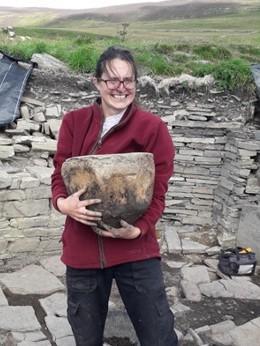 Person holding whale verterba