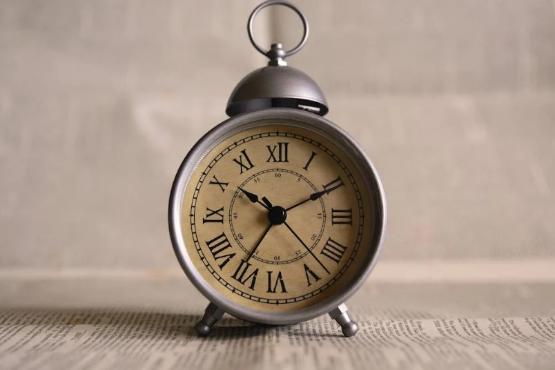 A clock on a shelf