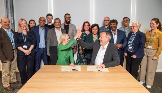 Professor Shirley Congdon and Neil Kirby with other partnership members behind