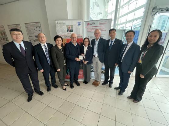 Delegates from China stood in a semi-circle in the engineering department