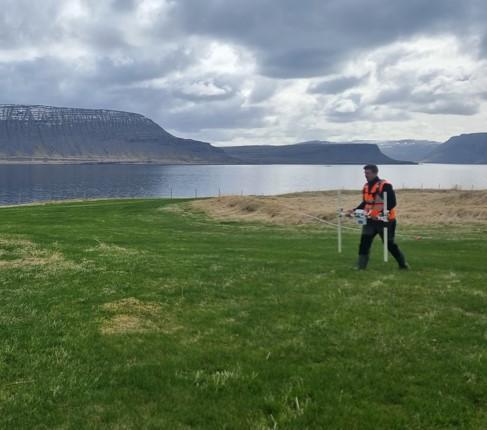 Scientist walking across Icelandic landscape