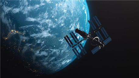 A satellite floating in space above the earth