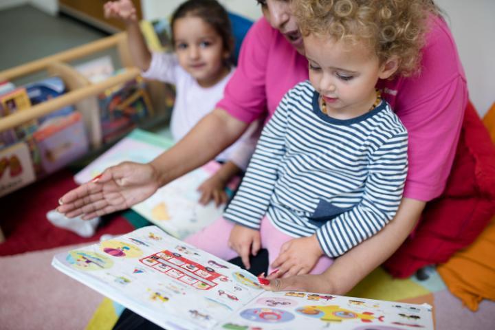 Child reading at the University of Bradford nursery.