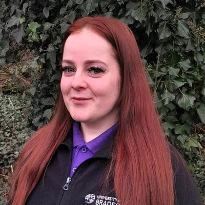 A smiling member of staff at the Nursery