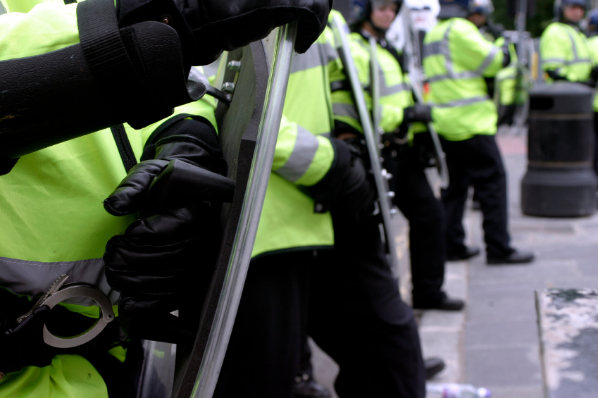 Line of police in riot gear