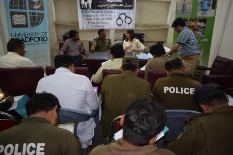 Samina presenting to a group in pakistan