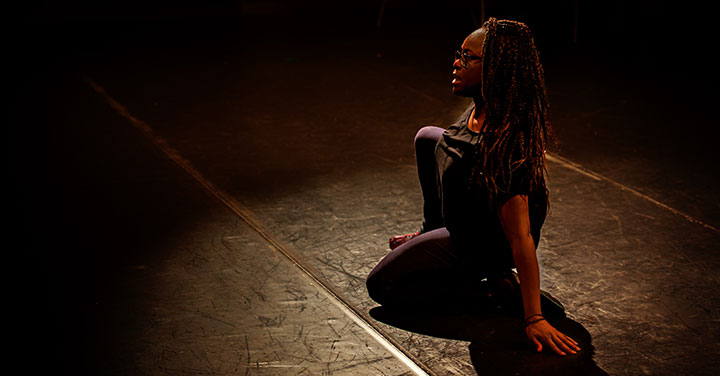 A student performing in a play