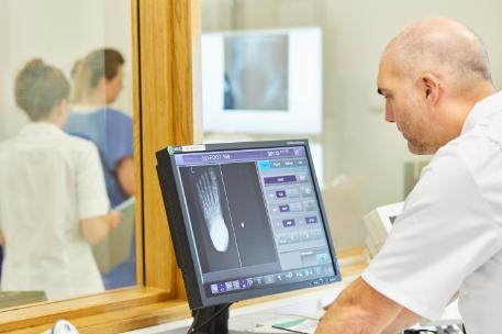 A student looking at an X-Ray.