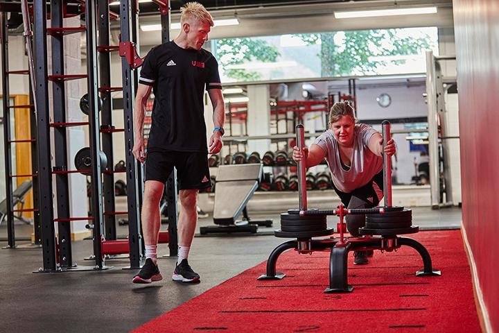 Katie and Dan training in the gym at Unique Fitness