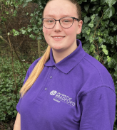 Staff member Sophie standing in the nursery garden